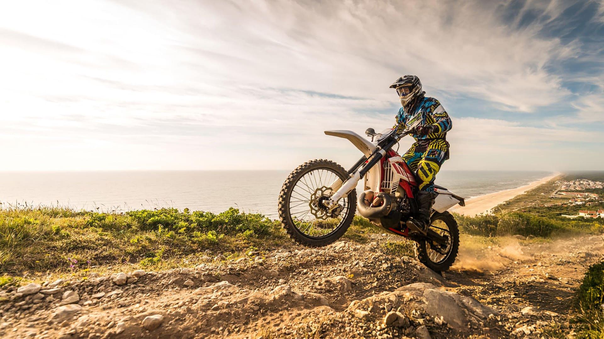 a motocross rider performing a stunt on a dirt bike
