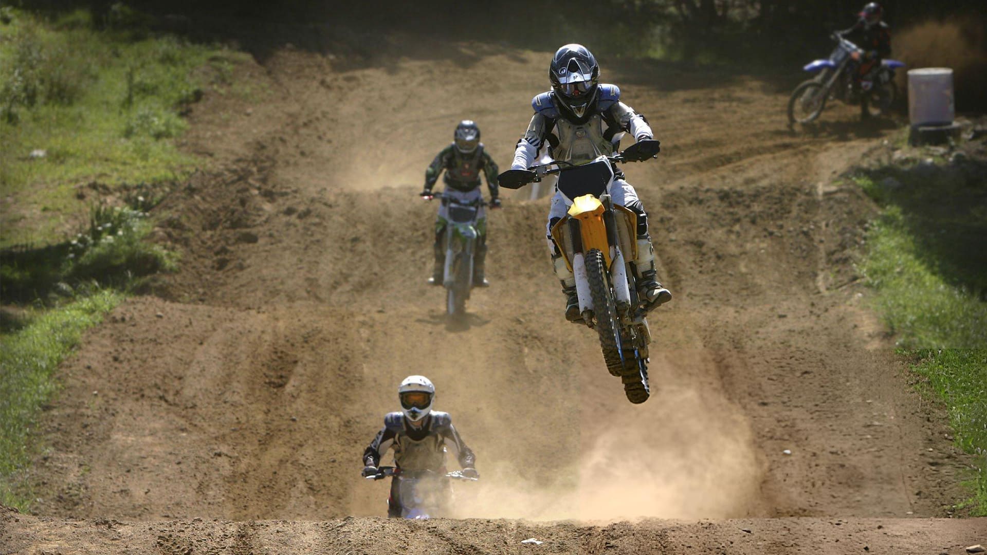 a motocross rider performing a stunt in a competition